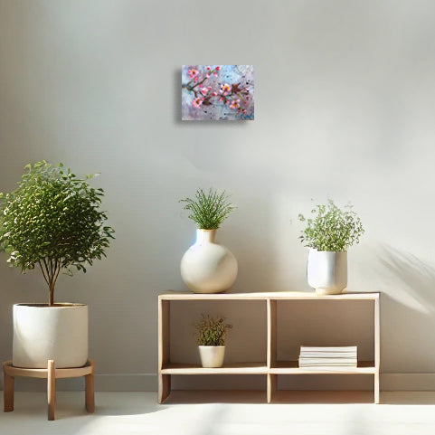Blush and Brag by Nimchi Yuen, a vibrant pink blossom painting with bold textures, displayed in a cozy, modern living room. Pink flowers stand out against a blue-purple sky, adding energy and a pop of color to the space.
