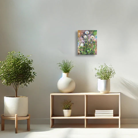 Dandelion Dreams by Nimchi Yuen, a textured dandelion painting, displayed in a cozy bedroom setting. Earthy tones ground soft white dandelions, adding a touch of nature and calm to the room decor.