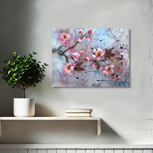 Blush and Brag by Nimchi Yuen, a vibrant pink blossom painting with bold textures, displayed in a cozy, modern living room. Pink flowers stand out against a blue-purple sky, adding energy and a pop of color to the space.